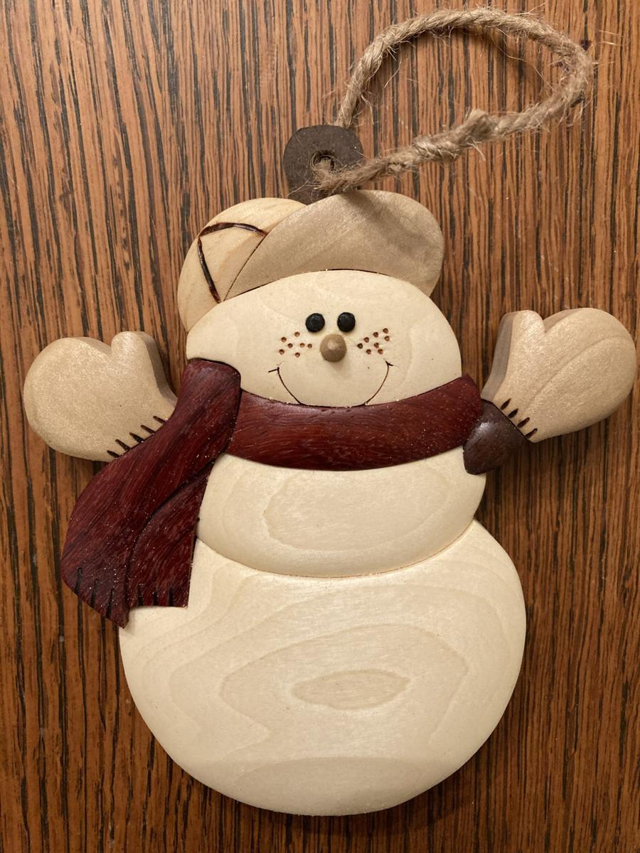 Intarsia snowman ornament with a red scarf