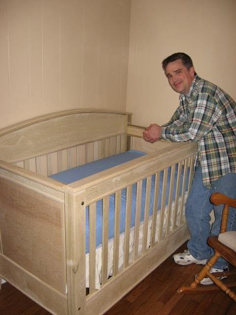 Mark Gifford with the crib he built for his daughter