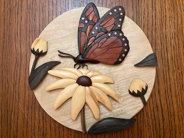 Intarsia monarch butterfly on a flower