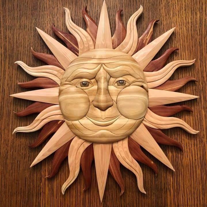 Intarsia sun wall hanging in cedar and light woods